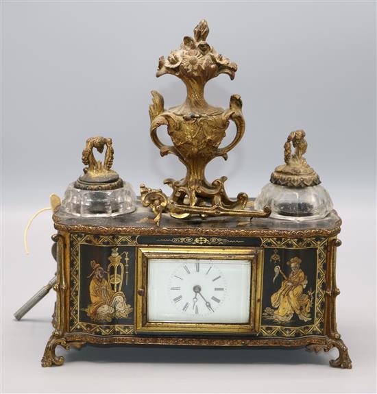 A 1920s black and gilt chinoiserie lacquered eight day mantel timepiece